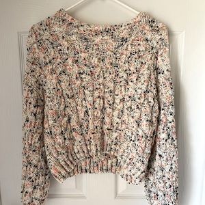 Cream colored cropped sweater with colored details